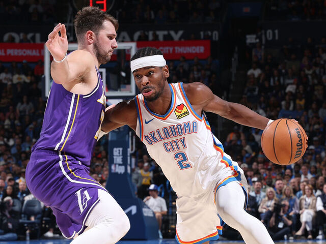OKLAHOMA CITY, OK - NOVEMBER 12: Shai Gilgeous-Alexander #2 of the Oklahoma City Thunder drives to the basket as Luka Doncic #77 of the Los Angeles Lakers plays defense during the game on November 12, 2025 at Paycom Center in Oklahoma City, Oklahoma. Mandatory Copyright Notice: Copyright 2025 NBAE