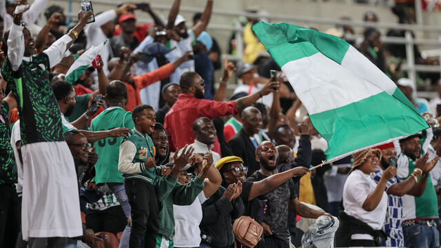 Nigerian supporters cheer after Nigeria's forward #20 Akor Adams scored their team's second goal during the FIFA World Cup 2026 Africa qualifiers group C match between Lesotho and Nigeria at the Peter Mokaba Stadium in Polokwane on October 10, 2025.