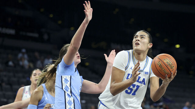 LAS VEGAS, NEVADA - NOVEMBER 13: Lauren Betts #51 of the UCLA Bruins shoots against Ciera Toomey #21 of the North Carolina Tar Heels in the fourth quarter of a 2025 WBCA Challenge game at Michelob ULTRA Arena on November 13, 2025 in Las Vegas, Nevada.
