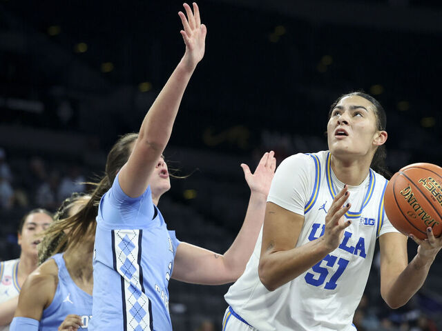 LAS VEGAS, NEVADA - NOVEMBER 13: Lauren Betts #51 of the UCLA Bruins shoots against Ciera Toomey #21 of the North Carolina Tar Heels in the fourth quarter of a 2025 WBCA Challenge game at Michelob ULTRA Arena on November 13, 2025 in Las Vegas, Nevada.