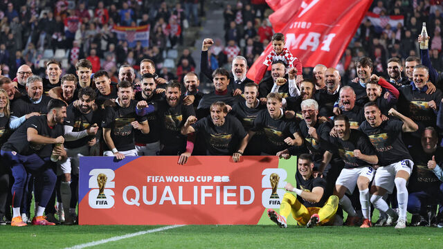 Croatian players, officials and their relatives celebrate their team's qualification for the World Cup at the end of the 2026 World Cup qualifiers Europe zone group L football match between Croatia and Faroe Islands at the Stadion HNK in Rijeka, on November 14, 2025.