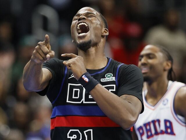 DETROIT, MICHIGAN - NOVEMBER 14: Javonte Green #31 of the Detroit Pistons celebrates in the front of Tyrese Maxey #0 of the Philadelphia 76ers after the 76ers turned over the ball during the fourth quarter of the Pistons' 114-105 win at Little Caesars Arena on November 14, 2025 in Detroit, Michigan.