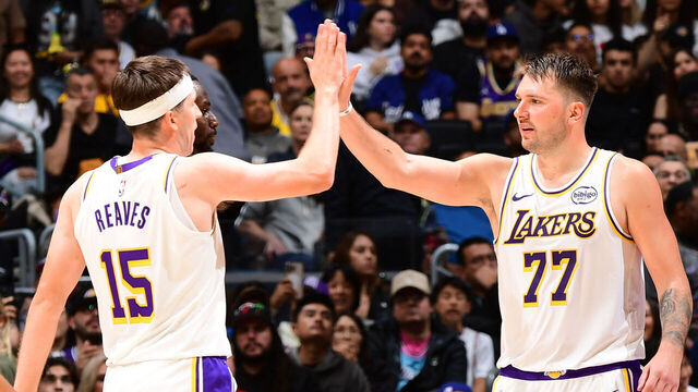 LOS ANGELES, CA - NOVEMBER 2: Austin Reaves #15 and Luka Doncic #77 of the Los Angeles Lakers high five during the game against the Miami Heat on November 2, 2025 at Crypto.Com Arena in Los Angeles, California. NOTE TO USER: User expressly acknowledges and agrees that, by downloading and/or using this Photograph, user is consenting to the terms and conditions of the Getty Images License Agreement. Mandatory Copyright Notice: Copyright 2025 NBAE