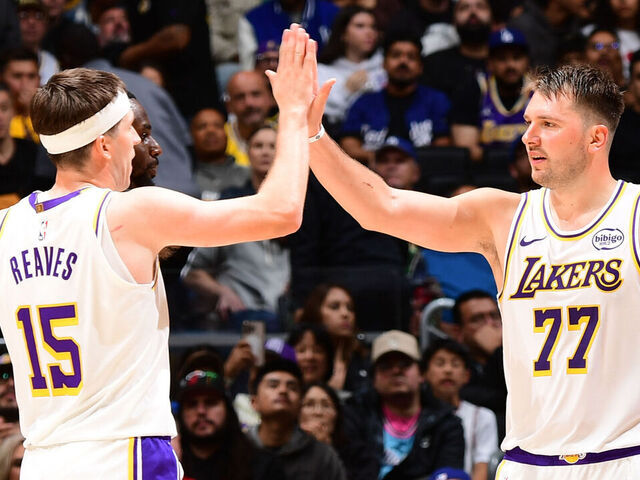 LOS ANGELES, CA - NOVEMBER 2: Austin Reaves #15 and Luka Doncic #77 of the Los Angeles Lakers high five during the game against the Miami Heat on November 2, 2025 at Crypto.Com Arena in Los Angeles, California. NOTE TO USER: User expressly acknowledges and agrees that, by downloading and/or using this Photograph, user is consenting to the terms and conditions of the Getty Images License Agreement. Mandatory Copyright Notice: Copyright 2025 NBAE