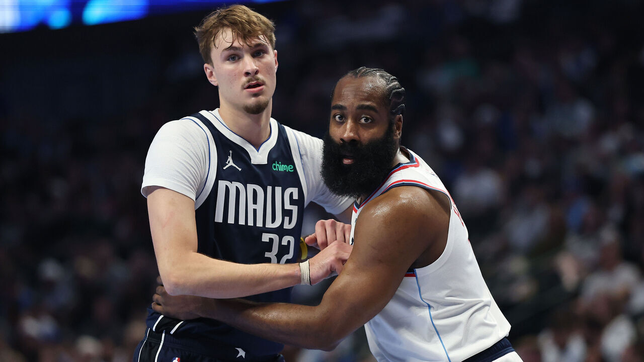 DALLAS, TEXAS - NOVEMBER 14: Cooper Flagg #32 of the Dallas Mavericks works against James Harden #1 of the LA Clippers during the first half of a 2025-26 Emirates NBA Cup game at American Airlines Center on November 14, 2025 in Dallas, Texas.