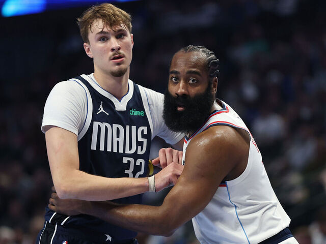 DALLAS, TEXAS - NOVEMBER 14: Cooper Flagg #32 of the Dallas Mavericks works against James Harden #1 of the LA Clippers during the first half of a 2025-26 Emirates NBA Cup game at American Airlines Center on November 14, 2025 in Dallas, Texas.