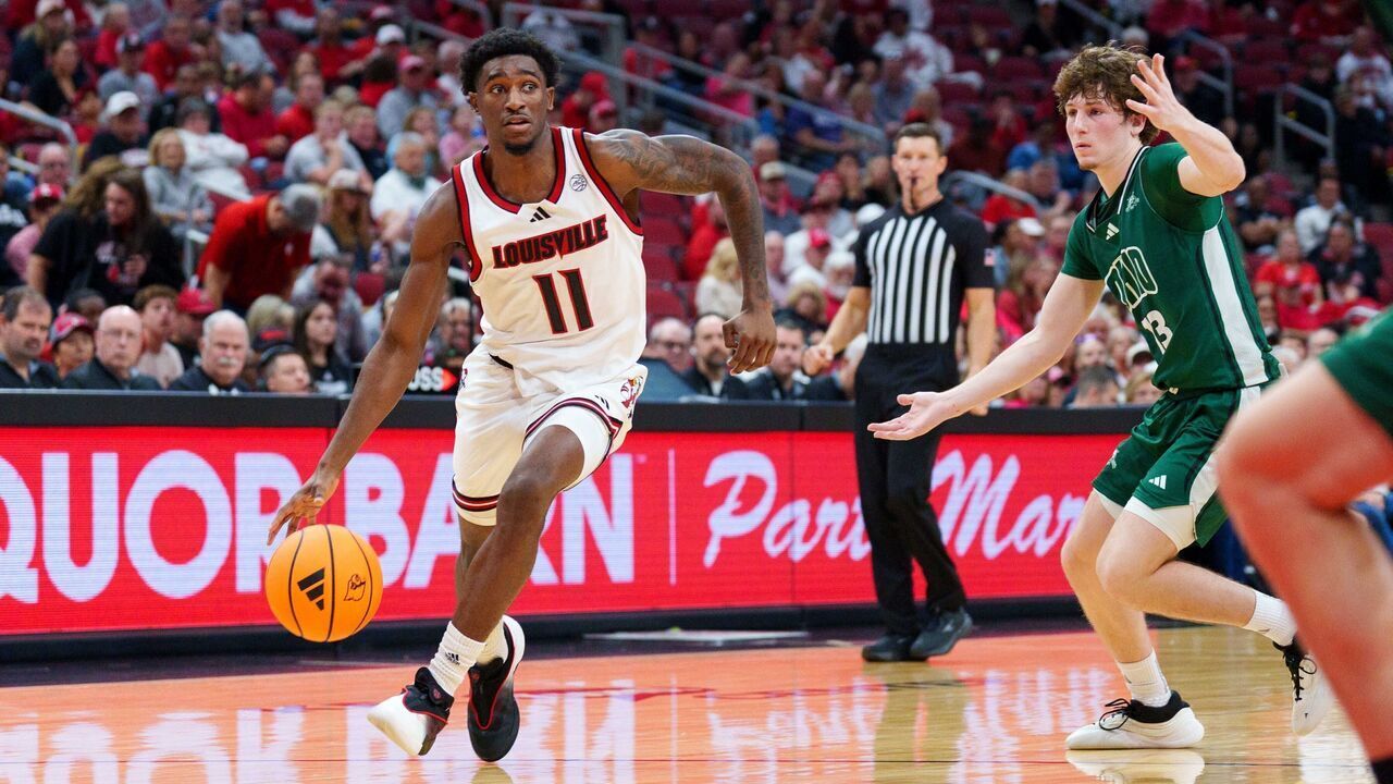 LOUISVILLE, KENTUCKY - NOVEMBER 15: Kobe Rodgers #11 of the Louisville Cardinals dibbles the ball up court against the Ohio Bobcats at KFC YUM! Center on November 15, 2025 in Louisville, Kentucky.