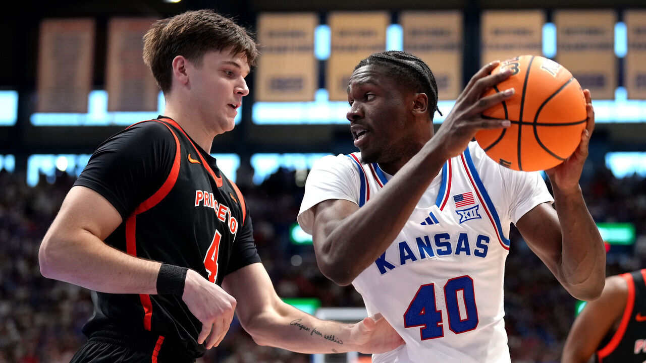 LAWRENCE, KANSAS - NOVEMBER 15: Flory Bidunga #40 of the Kansas Jayhawks drives against CJ Happy #4 of the Princeton Tigers in the first half at Allen Fieldhouse on November 15, 2025 in Lawrence, Kansas.