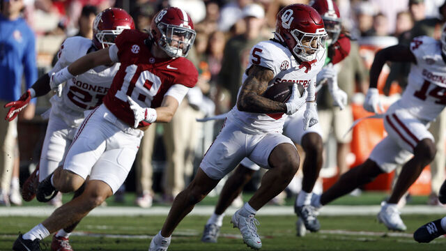TUSCALOOSA, ALABAMA - NOVEMBER 15: Isaiah Sategna III #5 of the Oklahoma Sooners caries the ball as Bray Hubbard #18 of the Alabama Crimson Tide pursues during the first half of a football game at Bryant Denny Stadium on November 15, 2025 in Tuscaloosa, Alabama.