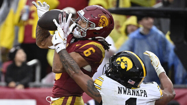 Los Angeles, CA - November 15: Wide receiver Makai Lemon #6 of the USC Trojans catches a pass in the end zone over defensive back Xavier Nwankpa #1 of the Iowa Hawkeyes for a touchdown in the second half of a NCAA football game at the Los Angeles Memorial Coliseum in Los Angeles on Saturday, November 15, 2025.