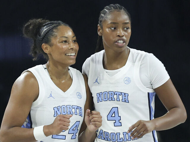 LAS VEGAS, NEVADA - NOVEMBER 15: Indya Nivar #24 and Laila Hull #4 of the North Carolina Tar Heels celebrate during a timeout in the third quarter of a 2025 WBCA Challenge game against the Fairfield Stags at Michelob ULTRA Arena on November 15, 2025 in Las Vegas, Nevada.