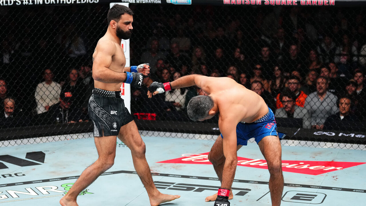 NEW YORK, NEW YORK - NOVEMBER 15: (L-R) Benoit Saint Denis of France strikes Beneil Dariush of Iran in a lightweight fight during the UFC 322 event at Madison Square Garden on November 15, 2025 in New York City.