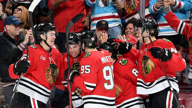 CHICAGO, ILLINOIS - NOVEMBER 15: Colton Dach #34 of the Chicago Blackhawks (middle) celebrates with teammates after scoring against the Toronto Maple Leafs in the third period at the United Center on November 15, 2025 in Chicago, Illinois.