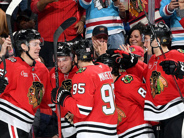 CHICAGO, ILLINOIS - NOVEMBER 15: Colton Dach #34 of the Chicago Blackhawks (middle) celebrates with teammates after scoring against the Toronto Maple Leafs in the third period at the United Center on November 15, 2025 in Chicago, Illinois.