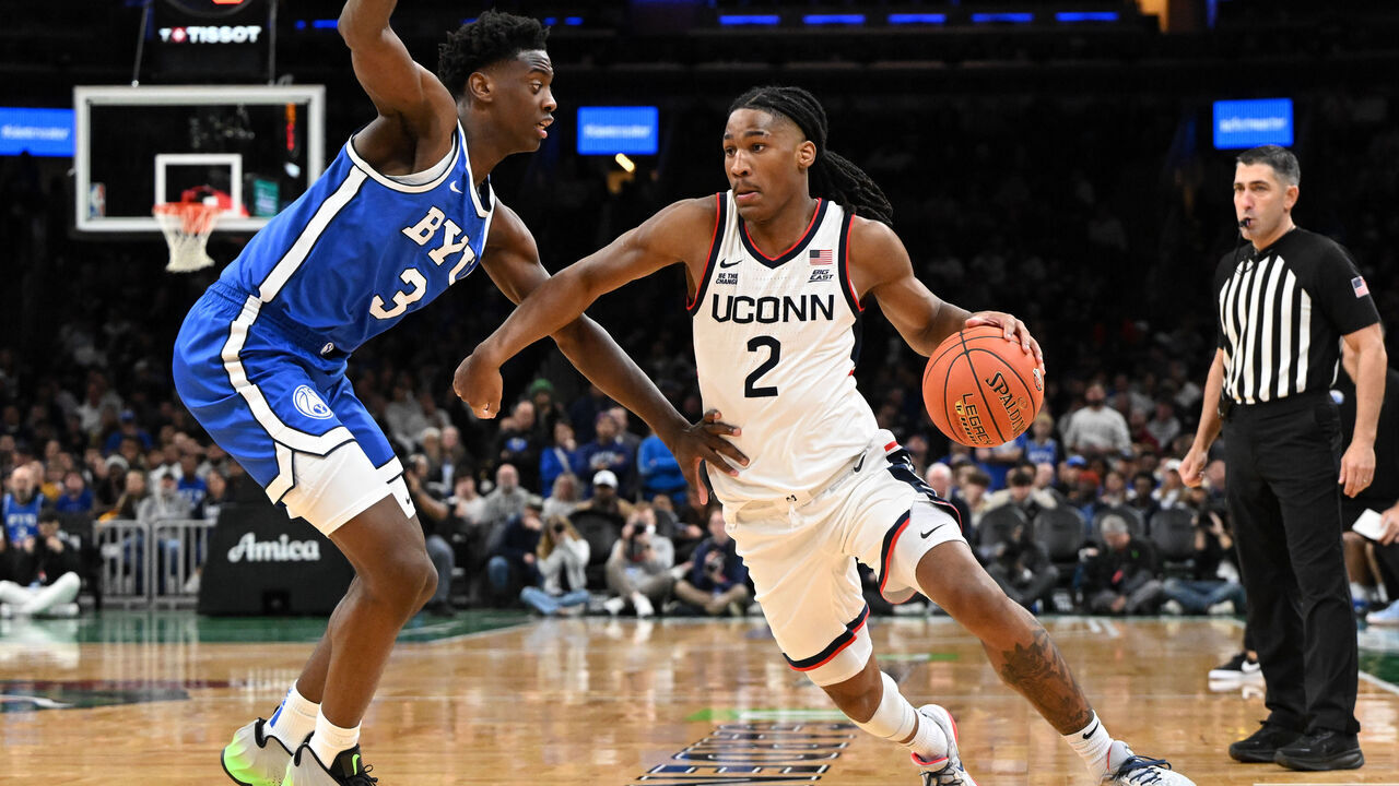 BOSTON, MASSACHUSETTS - NOVEMBER 15: Silas Demary Jr. #2 of the UConn Huskies drives to the basket against AJ Dybantsa #3 of the BYU Cougars during the second half at the TD Garden on November 15, 2025 in Boston, Massachusetts.