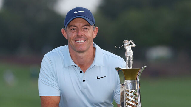 DUBAI, UNITED ARAB EMIRATES - NOVEMBER 16: Rory McIlroy of Northern Ireland poses with the Race to Dubai trophy on the 18th green on day four of the DP World Tour Championship 2025 at Jumeirah Golf Estates on November 16, 2025 in Dubai, United Arab Emirates.