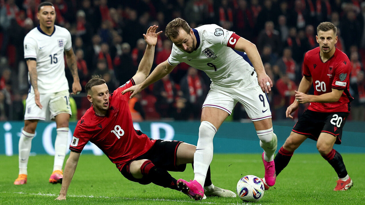 TIRANA, ALBANIA - NOVEMBER 16: Harry Kane of England is challenged by Ardian Ismajli of Albania during the FIFA World Cup 2026 qualifier match between Albania and England at Air Albania Stadium on November 16, 2025 in Tirana, Albania.
