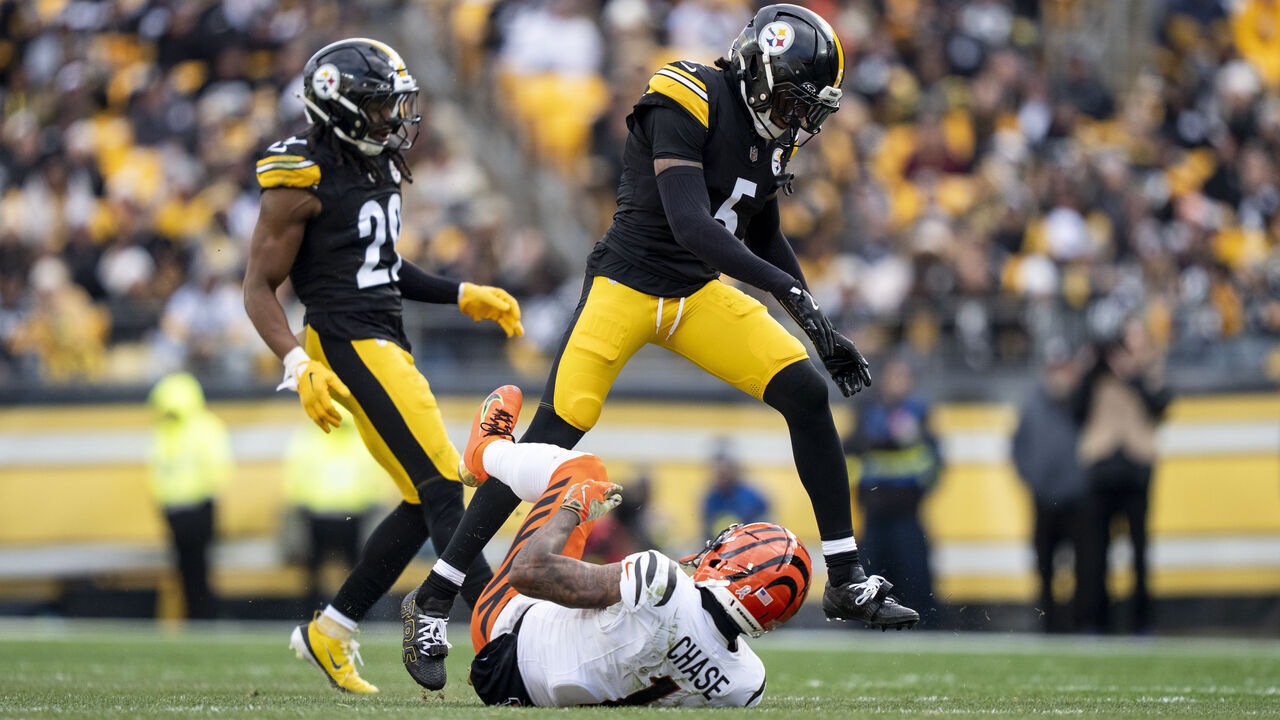 PITTSBURGH, PENNSYLVANIA - NOVEMBER 16: Jalen Ramsey #5 of the Pittsburgh Steelers reacts as he steps over Ja'Marr Chase #1 of the Cincinnati Bengals during an NFL football game at Acrisure Stadium on November 16, 2025 in Pittsburgh, Pennsylvania.