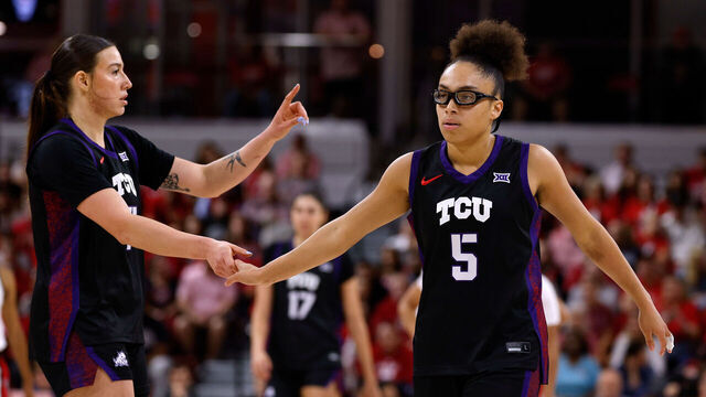RALEIGH, NORTH CAROLINA - NOVEMBER 16: Olivia Miles #5 high-fives Marta Suarez #7 of the TCU Horned Frogs in the first half against the NC State Wolfpack at Reynolds Coliseum on November 16, 2025 in Raleigh, North Carolina.