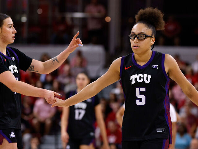 RALEIGH, NORTH CAROLINA - NOVEMBER 16: Olivia Miles #5 high-fives Marta Suarez #7 of the TCU Horned Frogs in the first half against the NC State Wolfpack at Reynolds Coliseum on November 16, 2025 in Raleigh, North Carolina.