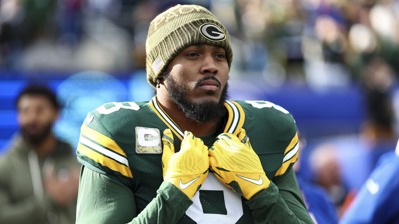 EAST RUTHERFORD, NEW JERSEY - NOVEMBER 16: Josh Jacobs #8 of the Green Bay Packers stands on the sidelines during the national anthem prior to an NFL football game against the New York Giants at MetLife Stadium on November 16, 2025 in East Rutherford, New Jersey.