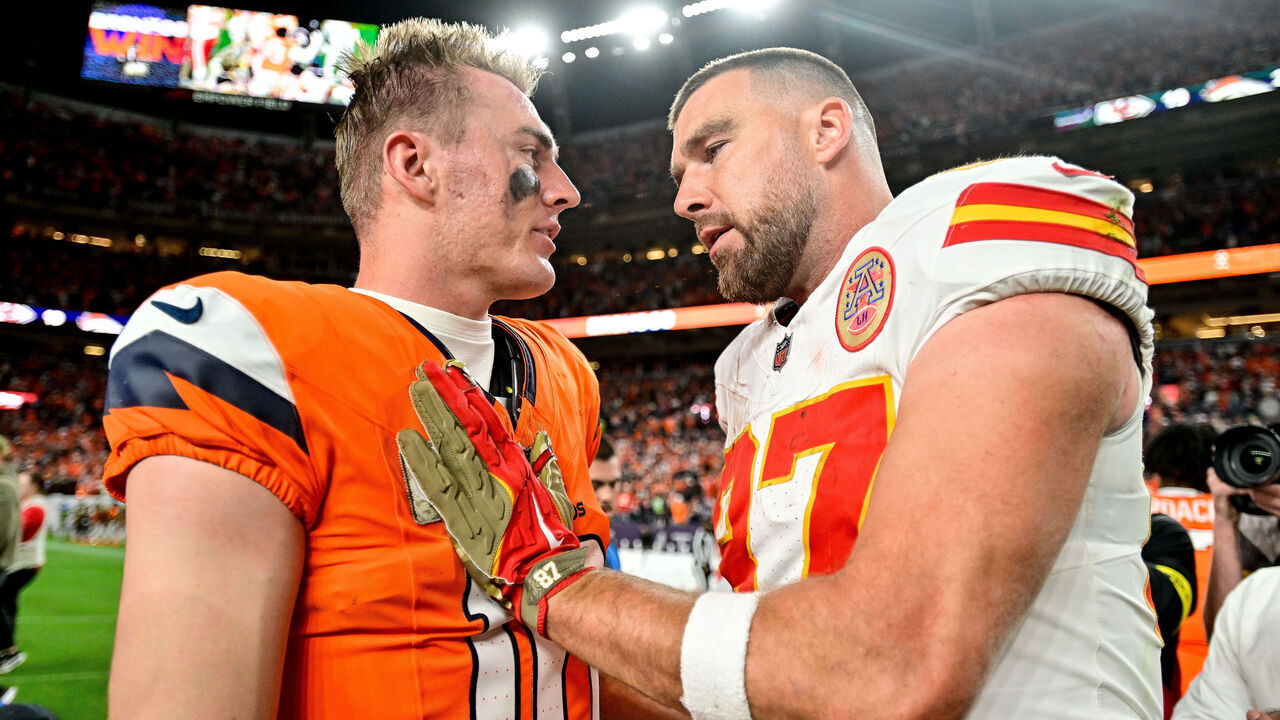 DENVER, CO - NOVEMBER 16: Kansas City Chiefs tight end Travis Kelce (87) has a word with Denver Broncos quarterback Bo Nix (10) after a game between the Kansas City Chiefs and the Denver Broncos at Empower Field at Mile High on November 16, 2025 in Denver, Colorado.