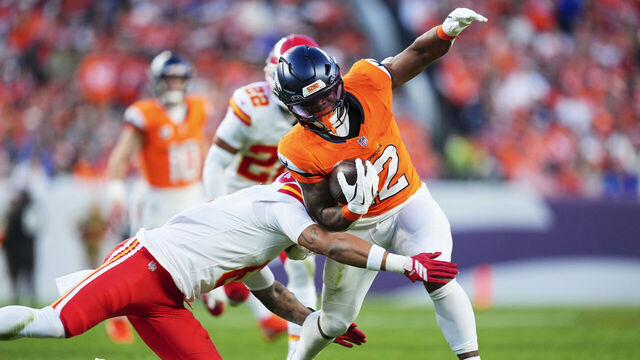 DENVER, CO - NOVEMBER 16: RJ Harvey #12 of the Denver Broncos carries the ball against the Kansas City Chiefs during the second half of an NFL football game at Empower Field at Mile High on November 16, 2025 in Denver, Colorado.