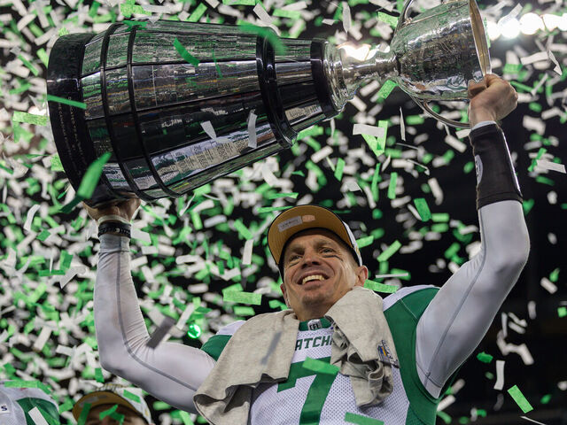 WINNIPEG, CANADA - NOVEMBER 16: Trevor Harris #7 of the Saskatchewan Roughriders hoists the Grey Cup after the 112th Grey Cup game between the Montreal Alouettes and Saskatchewan Roughriders at Princess Auto Stadium on November 16, 2025 in Winnipeg, Canada.