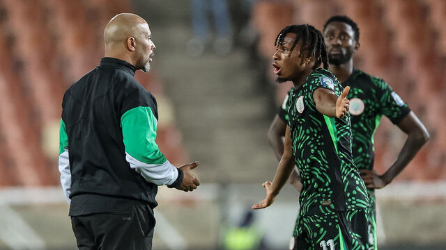 Nigeria's coach Eric Chelle (L) speaks to Nigeria's forward #11 Samuel Chukwueze after the FIFA World Cup 2026 Africa qualifiers group C match between Lesotho and Nigeria at the Peter Mokaba Stadium in Polokwane on October 10, 2025.