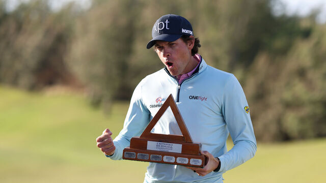 SOUTHAMPTON, BERMUDA - NOVEMBER 16: Adam Schenk of the United States celebrates with the winner's trophy after winning the Butterfield Bermuda Championship 2025 at Port Royal Golf Course on November 16, 2025 in Southampton, Bermuda.