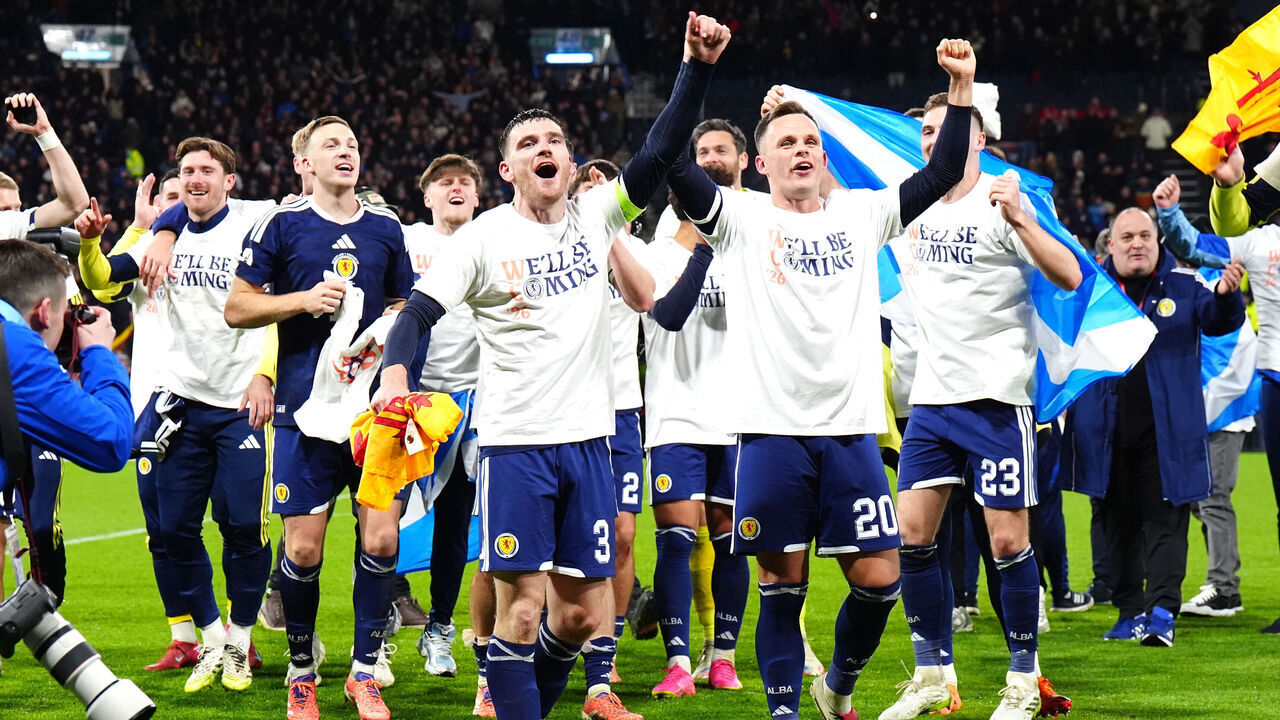 Scotland's Andrew Robertson and Scotland's Lawrence Shankland celebrate with team-mates after they qualified for the 2026 World Cup after beating Denmark 4-2 in their final qualifier at Hampden Park, Glasgow. Picture date: Tuesday November 18, 2025.