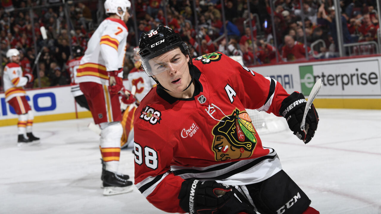 CHICAGO, ILLINOIS - NOVEMBER 18: Connor Bedard #98 of the Chicago Blackhawks reacts after scoring against the Calgary Flames in the third period at the United Center on November 18, 2025 in Chicago, Illinois.