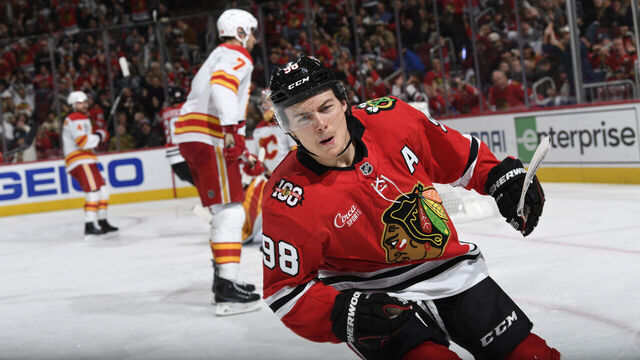 CHICAGO, ILLINOIS - NOVEMBER 18: Connor Bedard #98 of the Chicago Blackhawks reacts after scoring against the Calgary Flames in the third period at the United Center on November 18, 2025 in Chicago, Illinois.