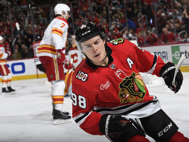 CHICAGO, ILLINOIS - NOVEMBER 18: Connor Bedard #98 of the Chicago Blackhawks reacts after scoring against the Calgary Flames in the third period at the United Center on November 18, 2025 in Chicago, Illinois.