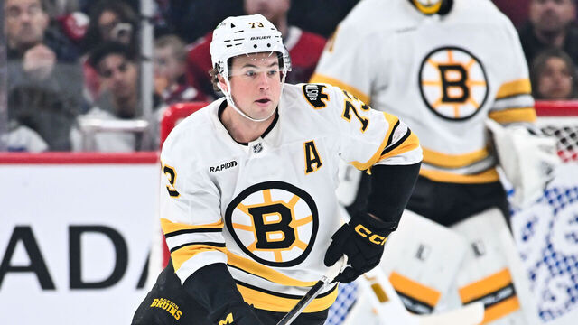 MONTREAL, CANADA - NOVEMBER 15: Charlie McAvoy #73 of the Boston Bruins handles the puck during the first period against the Montréal Canadiens at the Bell Centre on November 15, 2025 in Montreal, Quebec, Canada. The Boston Bruins defeated the Montréal Canadiens 3-2.