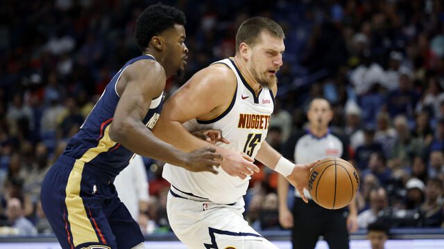 NEW ORLEANS, LOUISIANA - NOVEMBER 19: Nikola Jokic #15 of the Denver Nuggets is defended by Yves Missi #21 of the New Orleans Pelicans during the first half at Smoothie King Center on November 19, 2025 in New Orleans, Louisiana.