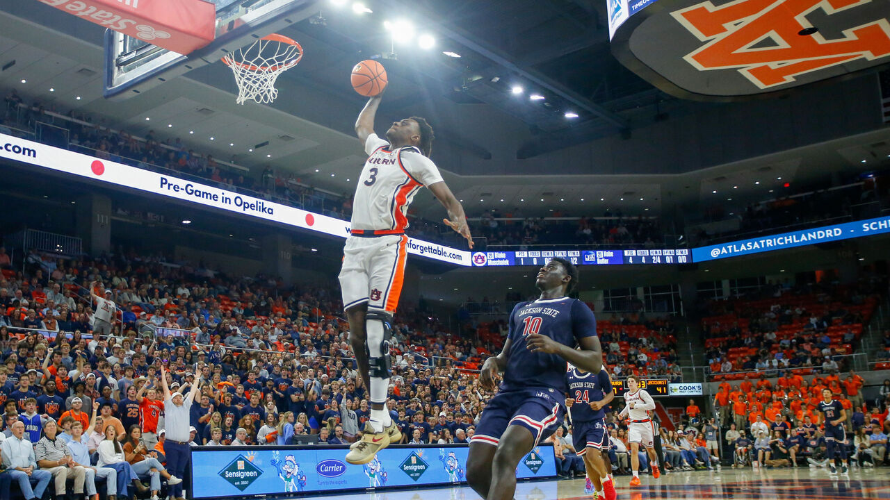 AUBURN, ALABAMA - NOVEMBER 19: KeShawn Murphy #3 of Auburn Tigers goes up for the slam dunk the ball during the second half against Jackson State at Neville Arena on November 19, 2025 in Auburn, Alabama.