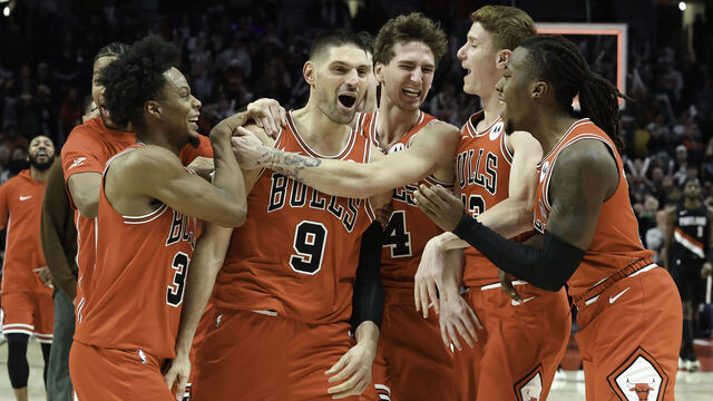 PORTLAND, OREGON - NOVEMBER 19: Nikola Vucevic #9 of the Chicago Bulls celebrates with teammates after making a buzzer-beating, three-point basket against the Portland Trail Blazers during the fourth quarter at the Moda Center on November 19, 2025 in Portland, Oregon. The Chicago Bulls won 122-121.