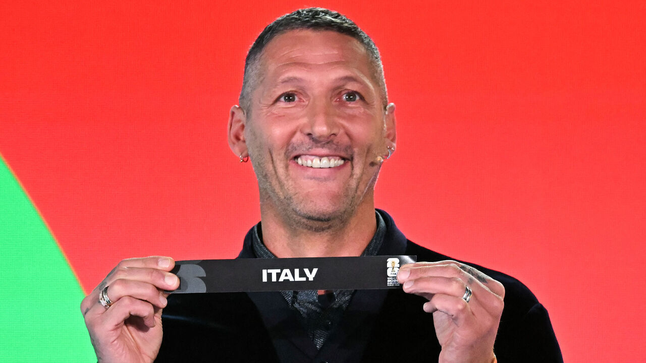 Italian former player Marco Materazzi shows the paper slip of Italy during the 2026 FIFA World Cup European Play-Off draw at the FIFA's Home of Football in Zurich on November 20, 2025.