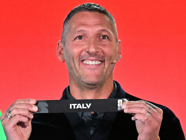 Italian former player Marco Materazzi shows the paper slip of Italy during the 2026 FIFA World Cup European Play-Off draw at the FIFA's Home of Football in Zurich on November 20, 2025.