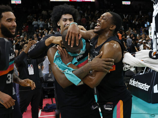 SAN ANTONIO, TX - NOVEMBER 20: De'Aaron Fox #4 of the San Antonio Spurs celebrates with David Jones Garcia #25 after they defeated Atlanta Hawks at Frost Bank Center on November 20, 2025 in San Antonio, Texas. NOTE TO USER: User expressly acknowledges and agrees that, by downloading and or using this photograph, User is consenting to terms and conditions of the Getty Images License Agreement.
