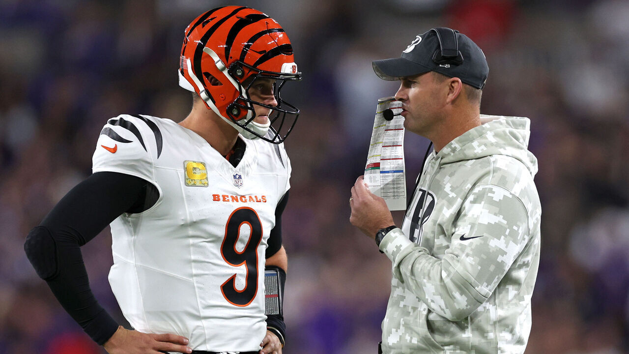 BALTIMORE, MARYLAND - NOVEMBER 07: Joe Burrow #9 and head coach Zac Taylor of the Cincinnati Bengals speak during the first quarter against the Baltimore Ravens at M&T Bank Stadium on November 07, 2024 in Baltimore, Maryland.