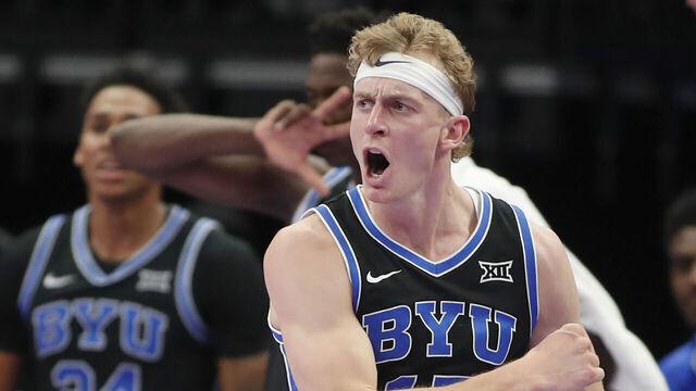 SALT LAKE CITY, UT - NOVEMBER 21: Richie Saunders #15 of the Brigham Young Cougars reacts after sinking a three point basket against the Wisconsin Badgers during the second half of their Bad Boys Mowers Series game at the Delta Center on November 21, 2025 in Salt Lake City, Utah.