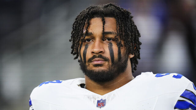 ARLINGTON, TX - DECEMBER 22: Marshawn Kneeland #94 of the Dallas Cowboys looks on from the sideline during the national anthem prior to an NFL football game against the Tampa Bay Buccaneers at AT&T Stadium on December 22, 2024 in Arlington, Texas.