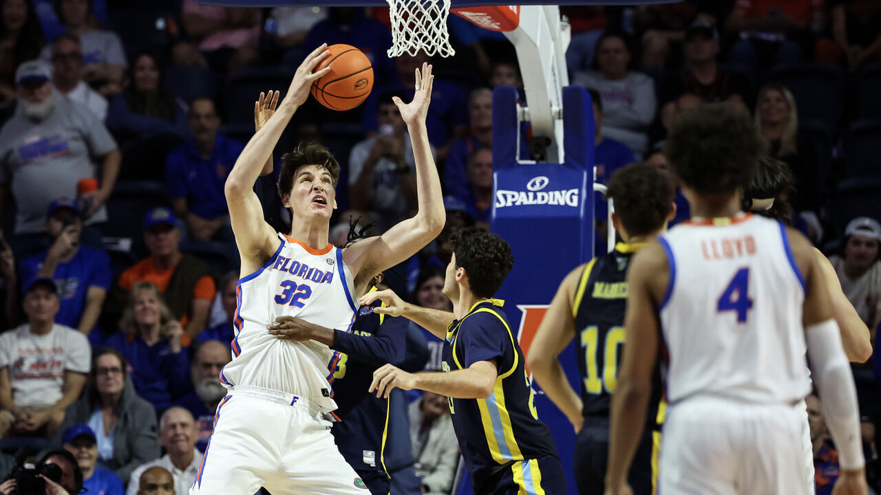 GAINESVILLE, FLORIDA - NOVEMBER 21: Olivier Rioux #32 of the Florida Gators rebounds the ball during the second half of a game against the Merrimack Warriors at the Stephen C. O'Connell Center on November 21, 2025 in Gainesville, Florida.