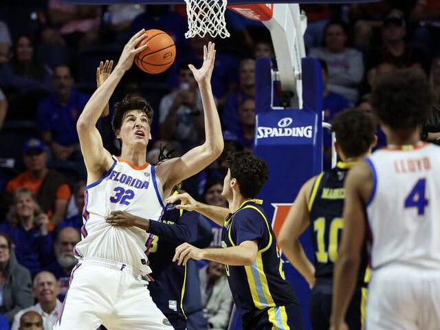 GAINESVILLE, FLORIDA - NOVEMBER 21: Olivier Rioux #32 of the Florida Gators rebounds the ball during the second half of a game against the Merrimack Warriors at the Stephen C. O'Connell Center on November 21, 2025 in Gainesville, Florida.