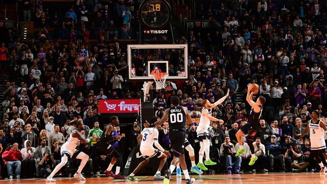 PHOENIX, AZ - NOVEMBER 21: Collin Gillespie #12 of the Phoenix Suns shoot the game-winning shot during the game against the Minnesota Timberwolves during the 2025-26 Emirates Cup on November 21, 2025 at PHX Arena in Phoenix, Arizona. Mandatory Copyright Notice: Copyright 2025 NBAE