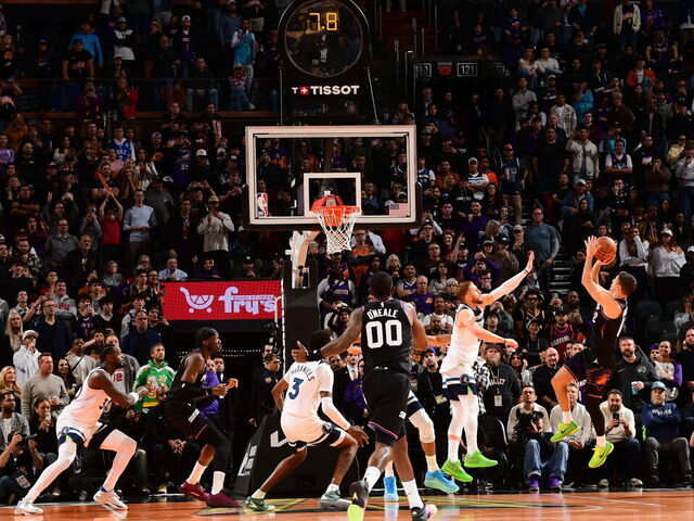 PHOENIX, AZ - NOVEMBER 21: Collin Gillespie #12 of the Phoenix Suns shoot the game-winning shot during the game against the Minnesota Timberwolves during the 2025-26 Emirates Cup on November 21, 2025 at PHX Arena in Phoenix, Arizona. Mandatory Copyright Notice: Copyright 2025 NBAE