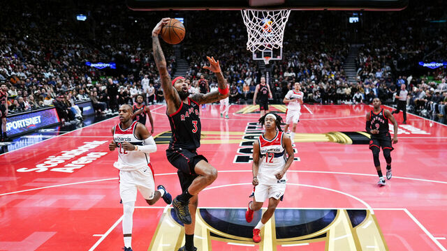TORONTO, CANADA - NOVEMBER 21: Brandon Ingram #3 of the Toronto Raptors dunks against Tre Johnson #12 and Khris Middleton #22 of the Washington Wizards during the first half of their basketball game at the Scotiabank Arena on November 21, 2025 in Toronto, Ontario, Canada. NOTE TO USER: User expressly acknowledges and agrees that, by downloading and/or using this Photograph, user is consenting to the terms and conditions of the Getty Images License Agreement.