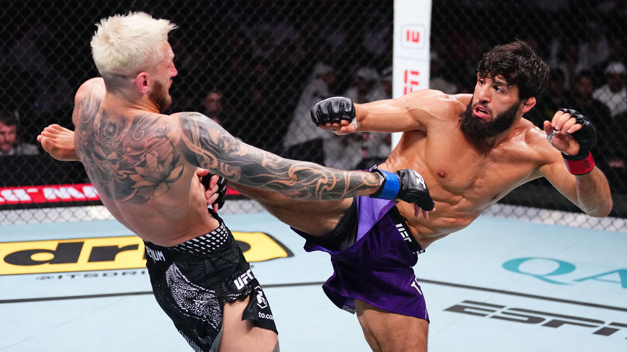 DOHA, QATAR - NOVEMBER 22: (R-L) Arman Tsarukyan of Georgia kicks Dan Hooker of New Zealand in a lightweight fight during the UFC Fight Night event at ABHA Arena on November 22, 2025 in Doha, Qatar.